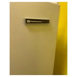 White Westinghouse upright freezer needs cleaned