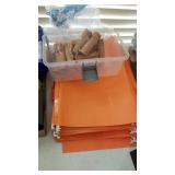 Empty paper quarter rolls, legal file folders and plastic container