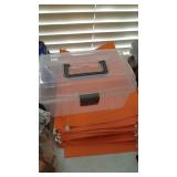 Empty paper quarter rolls, legal file folders and plastic container