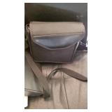 Ledger and 3 ring notebooks and empty Nikon case