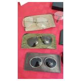 Glasses and clip on sunglasses and cleaner