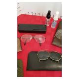 Glasses and clip on sunglasses and cleaner