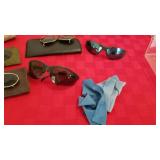 Glasses and clip on sunglasses and cleaner