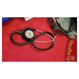 Omron arm cuff, stethoscope, lint brushes and heat lamp