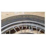 Used Harley Davidson Dunlop D401F 100/90-19 M/C 57H Front Motorcycle Tire mounted on a spoked chrome rim w/brake plates
