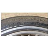 Used Harley Davidson Dunlop D401F 100/90-19 M/C 57H Front Motorcycle Tire mounted on a spoked chrome rim w/brake plates