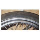 Used Harley Davidson Dunlop D401F 100/90-19 M/C 57H Front Motorcycle Tire mounted on a spoked chrome rim w/brake plates