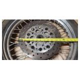 Used Harley Davidson Dunlop D401F 100/90-19 M/C 57H Front Motorcycle Tire mounted on a spoked chrome rim w/brake plates