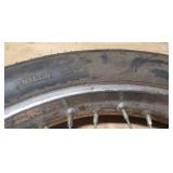 Used CS Hi-Max 100/90-19 57H Front Motorcycle Tire mounted on a spoked chrome rim w/brake plate