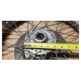 Used CS Hi-Max 100/90-19 57H Front Motorcycle Tire mounted on a spoked chrome rim w/brake plate