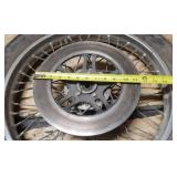 Used CS Hi-Max 100/90-19 57H Front Motorcycle Tire mounted on a spoked chrome rim w/brake plate