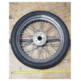 New Dunlop D404F 100/90-19 M/C 57H Front Motorcycle Tire mounted on a spoked chrome rim