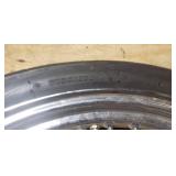 New Dunlop D404F 100/90-19 M/C 57H Front Motorcycle Tire mounted on a spoked chrome rim