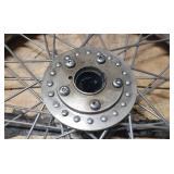 New Dunlop D404F 100/90-19 M/C 57H Front Motorcycle Tire mounted on a spoked chrome rim