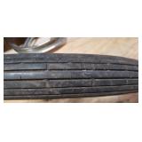 Used Cheng Shin 2.75 - 17 4 ply Front Motorcycle Tire mounted on a spoked chrome rim