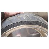 Used Metzeler ME 880 Marathon Steel Radial 240-40 R 18 m-c (79V) Rear Motorcycle Tire mounted on a solid chrome rim