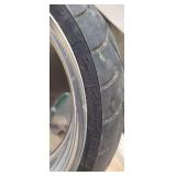 Used Metzeler ME 880 Marathon Steel Radial 240-40 R 18 m-c (79V) Rear Motorcycle Tire mounted on a solid chrome rim