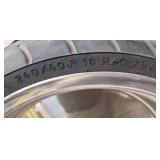 Used Metzeler ME 880 Marathon Steel Radial 240-40 R 18 m-c (79V) Rear Motorcycle Tire mounted on a solid chrome rim