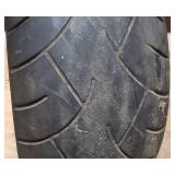 Used Metzeler ME 880 Marathon Steel Radial 240-40 R 18 m-c (79V) Rear Motorcycle Tire mounted on a solid chrome rim