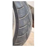 Used Metzeler ME 880 Marathon Steel Radial 240-40 R 18 m-c (79V) Rear Motorcycle Tire mounted on a solid chrome rim