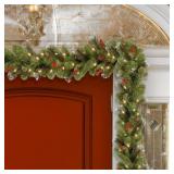 Artificial Garland 9-foot Spruce Garland with Silver Bristle, Cones, Red Berries and Glitter with 50 Clear Lights - Green Retail: $48.99