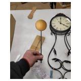 Wrought Iron Metal Wall Clock with Suspended Pendulum