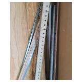 Contents of Corner (Wood, Wood Clamp, Crowbar, and Metal)