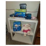 Shelf with Contents (games, backpack, and stuffed lamb)
