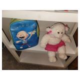Shelf with Contents (games, backpack, and stuffed lamb)