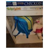 Shelf with Contents (games, backpack, and stuffed lamb)