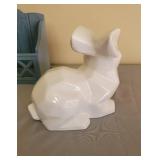 Ceramic Rabbit, Candle in Dish, and Wooden Shelf