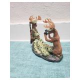 Deer taking pictures of a Hunter they caught figurine