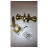 Kwikset Tylo Hall/Closet Passage Door Knob in Polished Brass