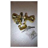 Kwikset Tylo Hall/Closet Passage Door Knob in Polished Brass