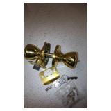 Kwikset Tylo Hall/Closet Passage Door Knob in Polished Brass