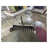 Yard aerator/thatcher