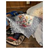 Stack of throws & purses & bags, linens