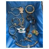 Flat of mostly costume jewelry bracelets