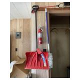 4 tools on hooks over closet door