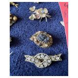 Row 6 - 7 brooches
