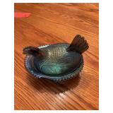 Blue iridescent hen on nest