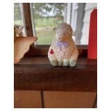 Angel & lamb decor in window