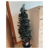 Christmas tree in black stand