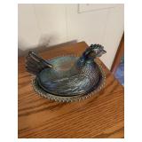 Blue iridescent hen on nest