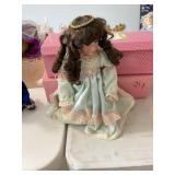 4 porcelain dolls w/boxes