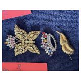 Row 2 - 9 brooches