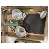 Flat of green handled kitchen items