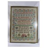 Vintage cross stitched alphabet framed