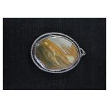 Large round stone with silver?