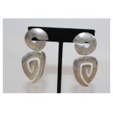 Pair of silver? dangle shape earrings